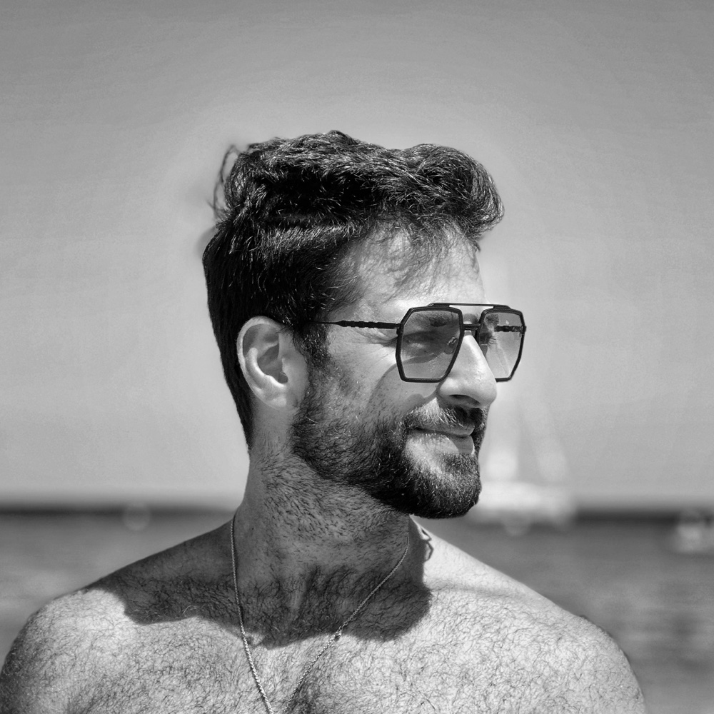 Black-and-white portrait of Zachary Casler wearing sunglasses